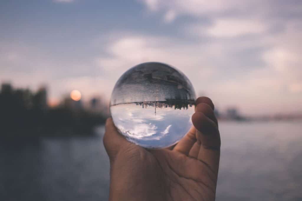 person holding crystal ball